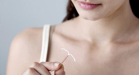 Woman looking at a coil implant