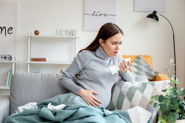 pregnant woman coughing